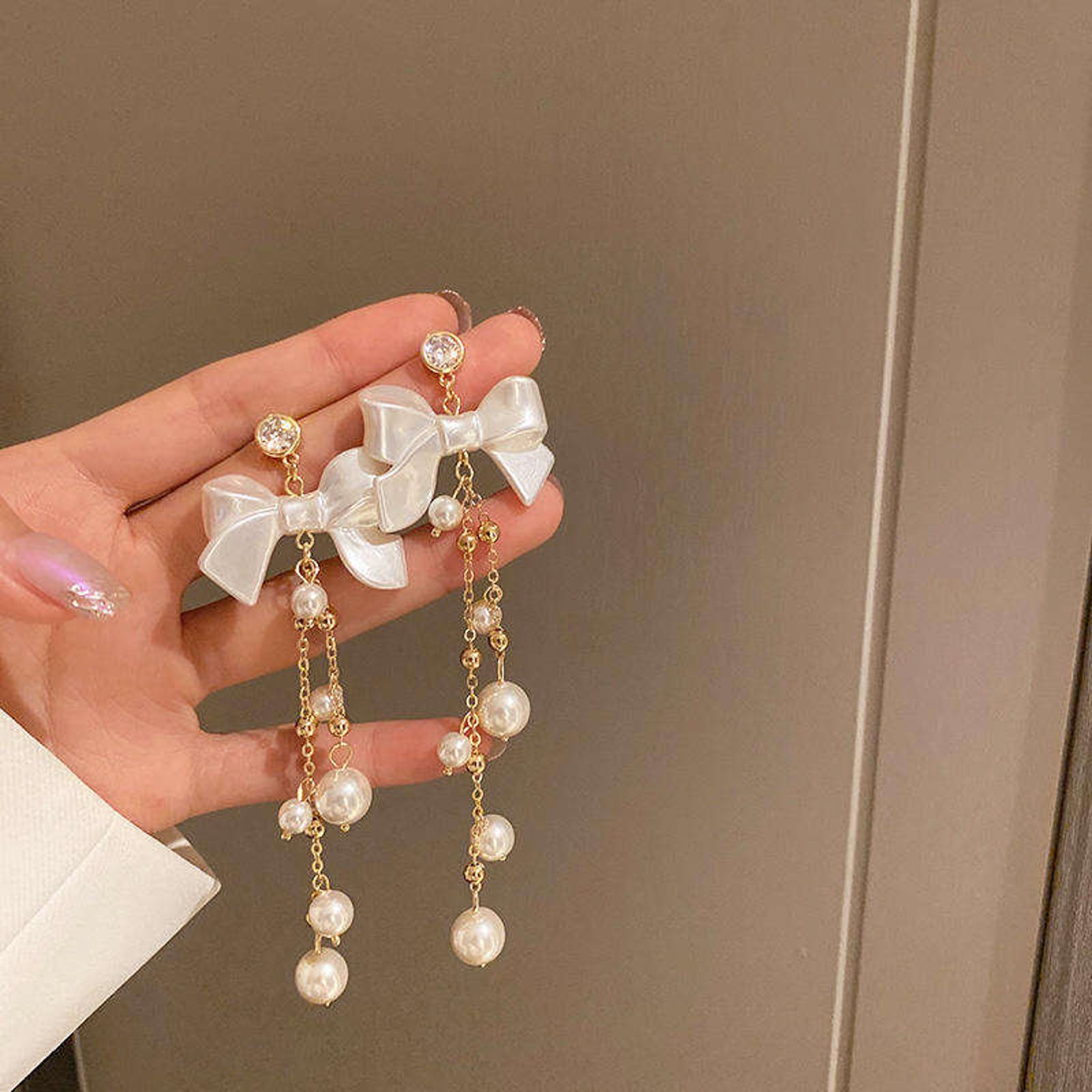 White Bow Pearl Chain Earrings for Women – Elegant Gold Dangle Design