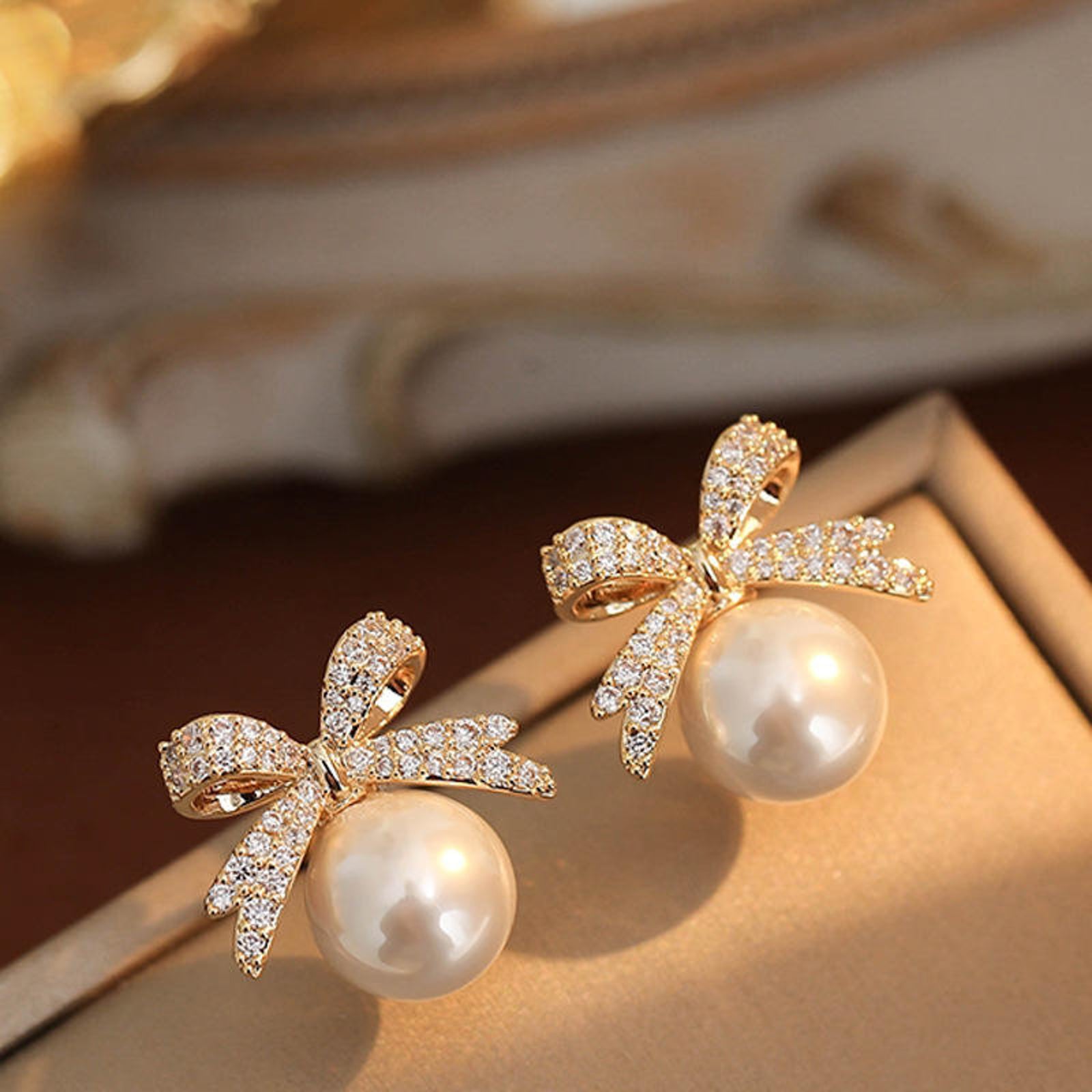 Gold Crystal Bow Pearl Earrings – Sparkling Pavé Ribbon Studs, Elegant Bridal and Occasion Jewelry for Women